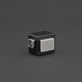 Small environmental sensor housing on a charcoal studio background